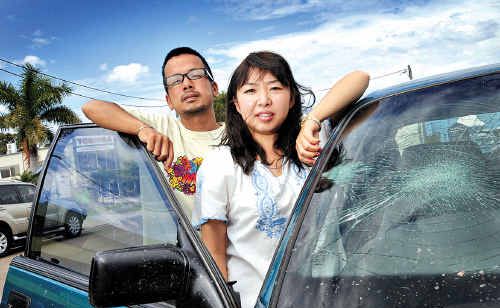 Junichi Tomotaki and Hiromi Matsuki say they were racially abused and their car damaged by an angry employer. Junichi Tomotaki and Hiromi Matsuki say they were racially abused and their car damaged by an angry employer.